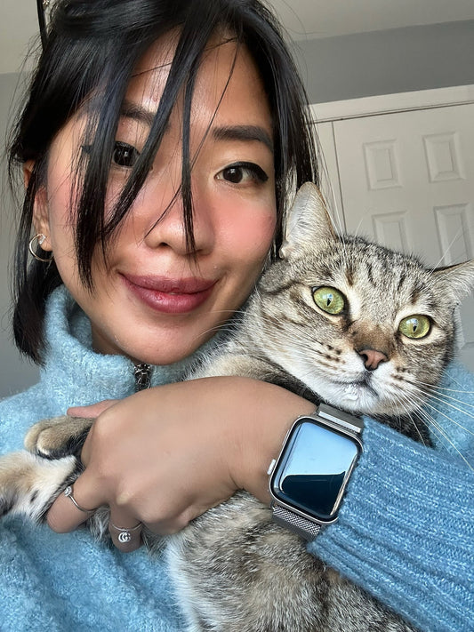 A selfie of the owner of Furpples holding her tabby cat, introducing herself to the blog readers.